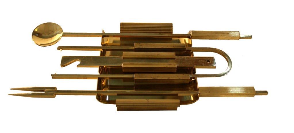 Gio Ponti Style Italian Brass Bar Tool Set.Original 1950's production, with impressed made in Italy stamping this 4 piece tool set includes a bottle opener, mixing spoon ,ice tong and long cocktail fork, all neatly housed on top of a 4 sided brass