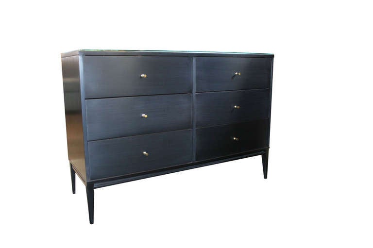 Paul McCobb 6 drawer Planner Group dresser Ca.1950s.Fully restored in a piano black lacquer finish with original polished solid brass drawer pulls.Constructed of solid maple throughout the dresser is very solid and in like new restored