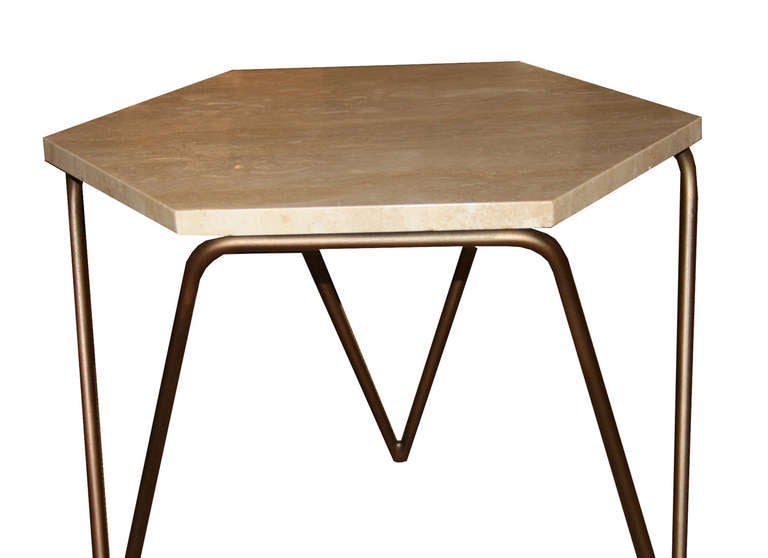 Tom tripod hexagon table shown in satin brass with natural polished travertine top.

Custom orders have a lead time of 10-12 weeks FOB NYC. Lead time contingent upon selection of finishes, approval of shop drawings (if applicable) and receipt COM