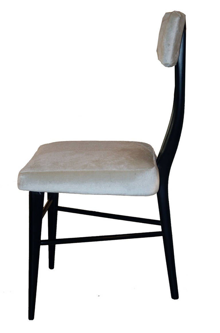Sculptural set of six 1950s dining chairs in fully restored condition. Sculptural solid frames with black lacquer satin finish support floating seat and backrest. Refinished and reupholstered.