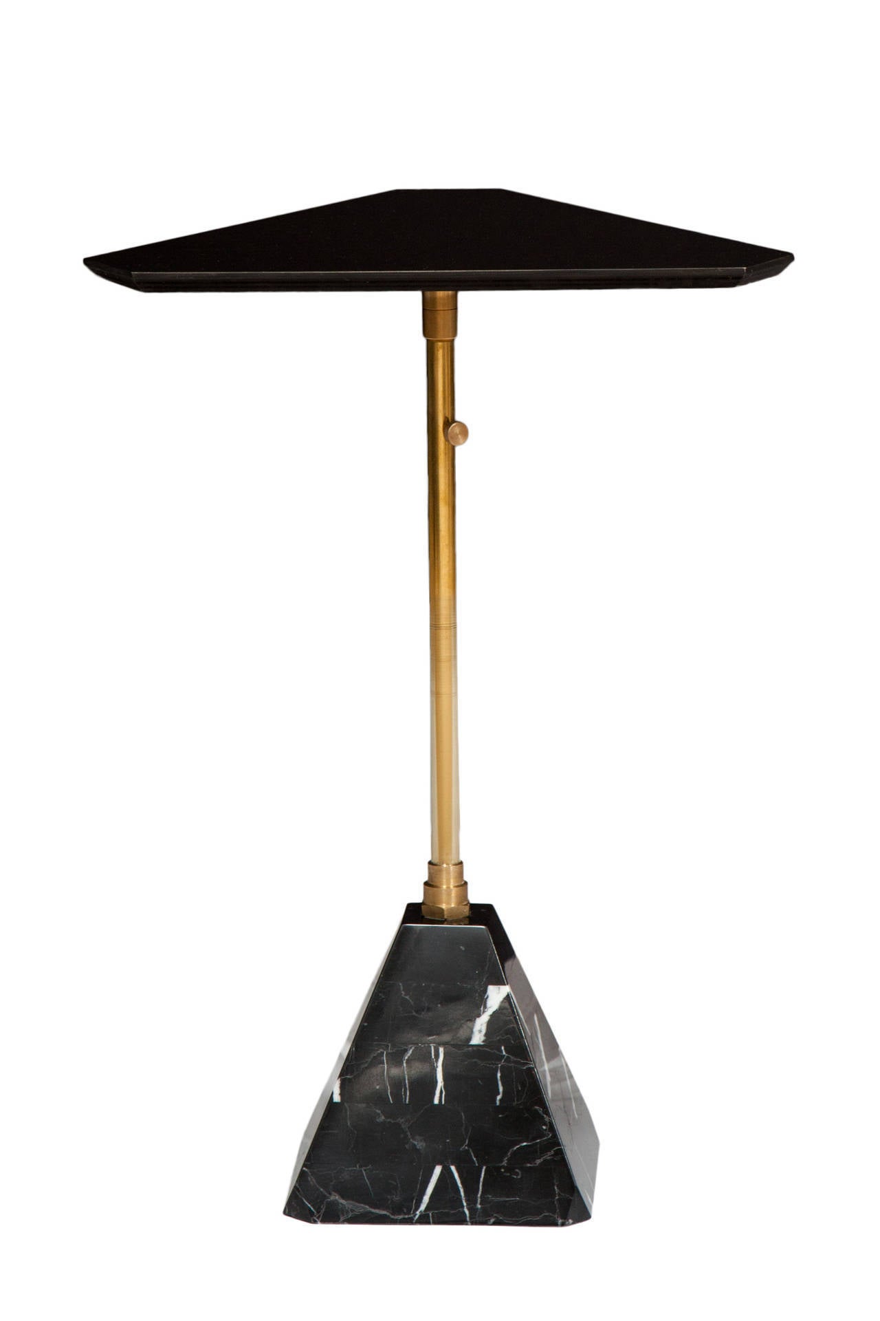Pyramid marble base cocktail table with telescoping swivel post that supports solid black Colorfin top.
Designed by Ben Erickson for Erickson Aesthetics .

Custom orders have a lead time of 10-12 weeks FOB NYC. Lead time contingent upon selection of