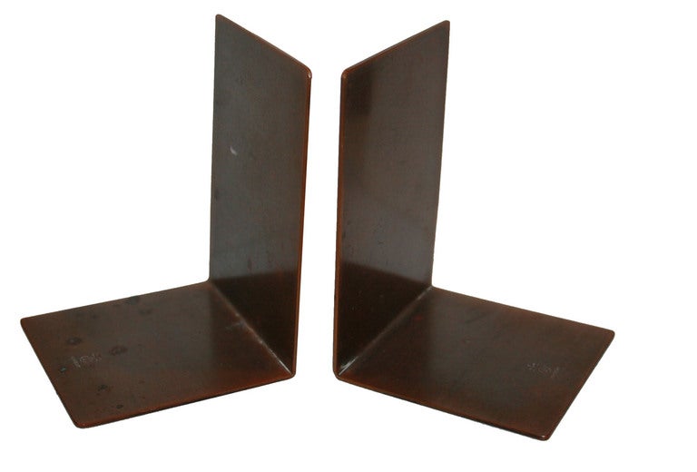 Early 20th Century Arts and Craft Roycroft Copper bookends.Original patina on folded copper minimalist bookends with stamped Roycroft marking.
