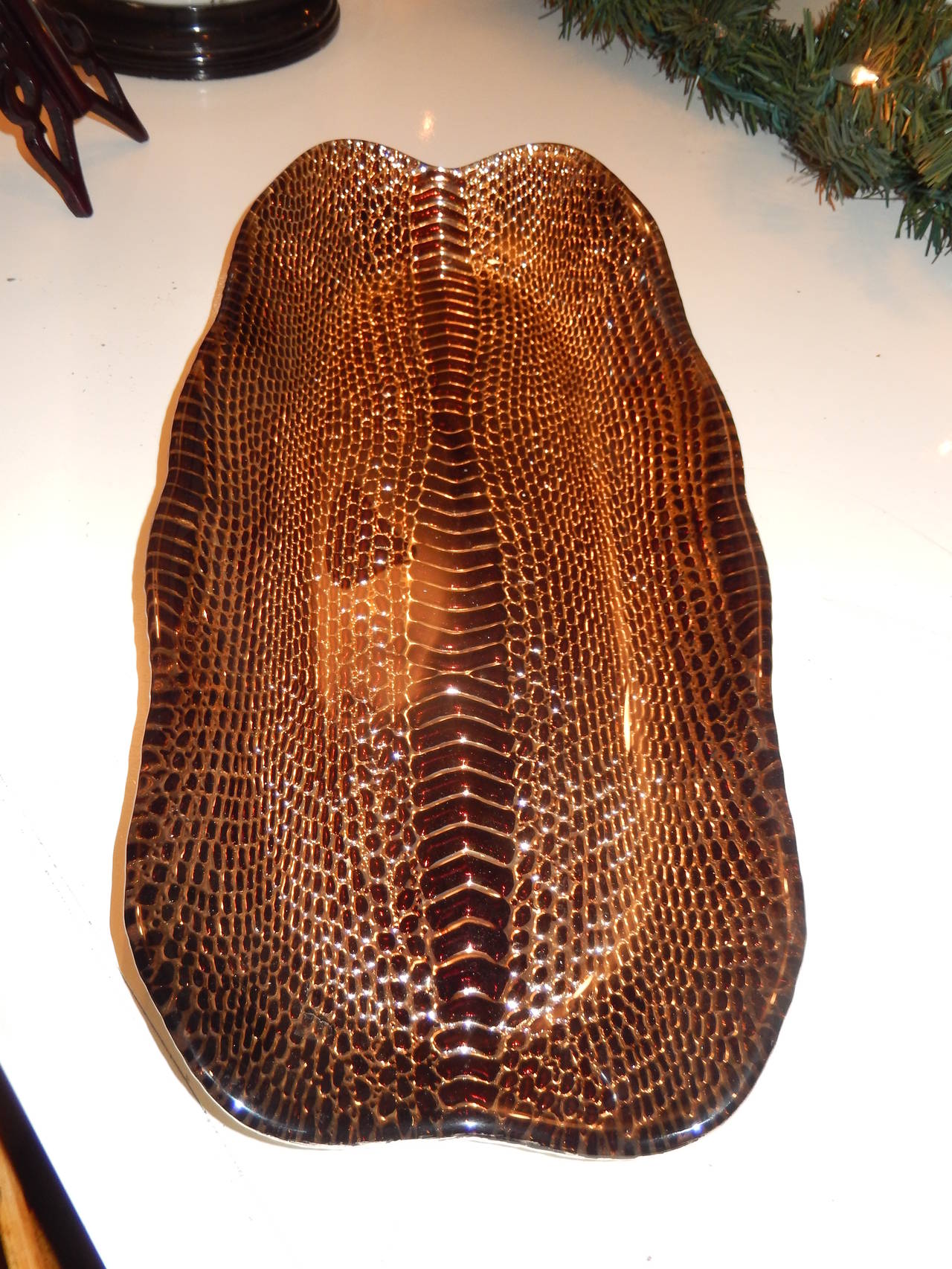 A stunning large python themed glass and silver platter.Beautiful tones of chestnut and gold in relief ,silver backed on bottom of the platter.