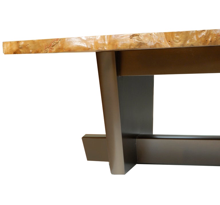 All handcrafted in the Studio Craft tradition. A large two-piece Ash Burl book-matched (end to end) free-edge coffee table. The base has a custom pigmented powder finish, in a natural bronze tone, the entire table is top coated in a clear lacquer,