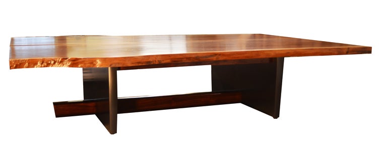 Studio handcrafted, free edge coffee table in bookmatched walnut wood. The base has a custom pigmented graphite finish; the entire table has a clear 40% sheen lacquer coating.