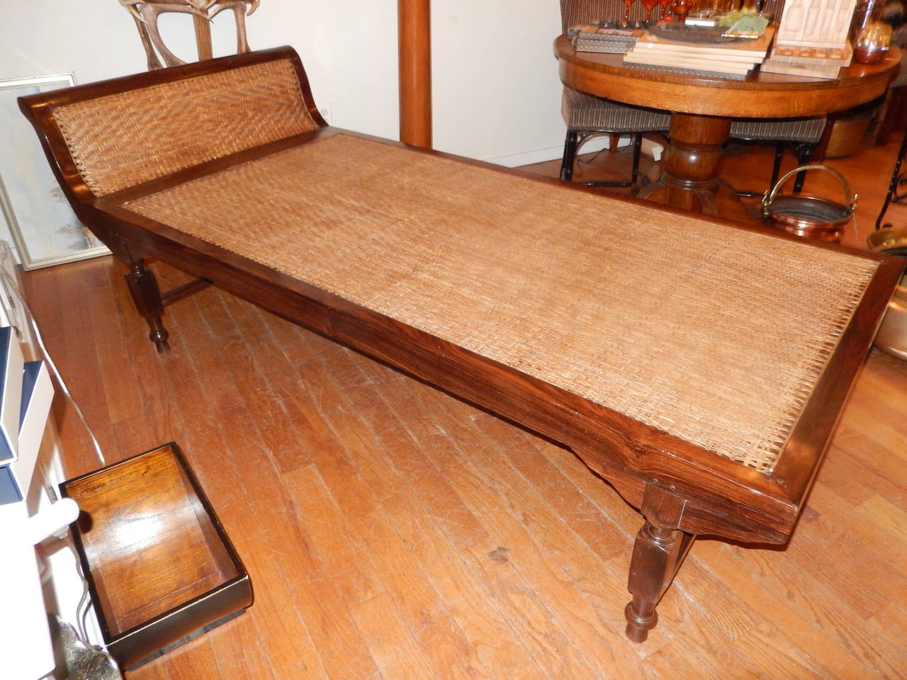 A rare West Indies oversized chaise. Solid rosewood frame and caned seat.
The caning is in excellent condition as is the rosewood. Both the cane work and frame are totally and beautifully handcrafted. A wonderful conversation piece for any room.