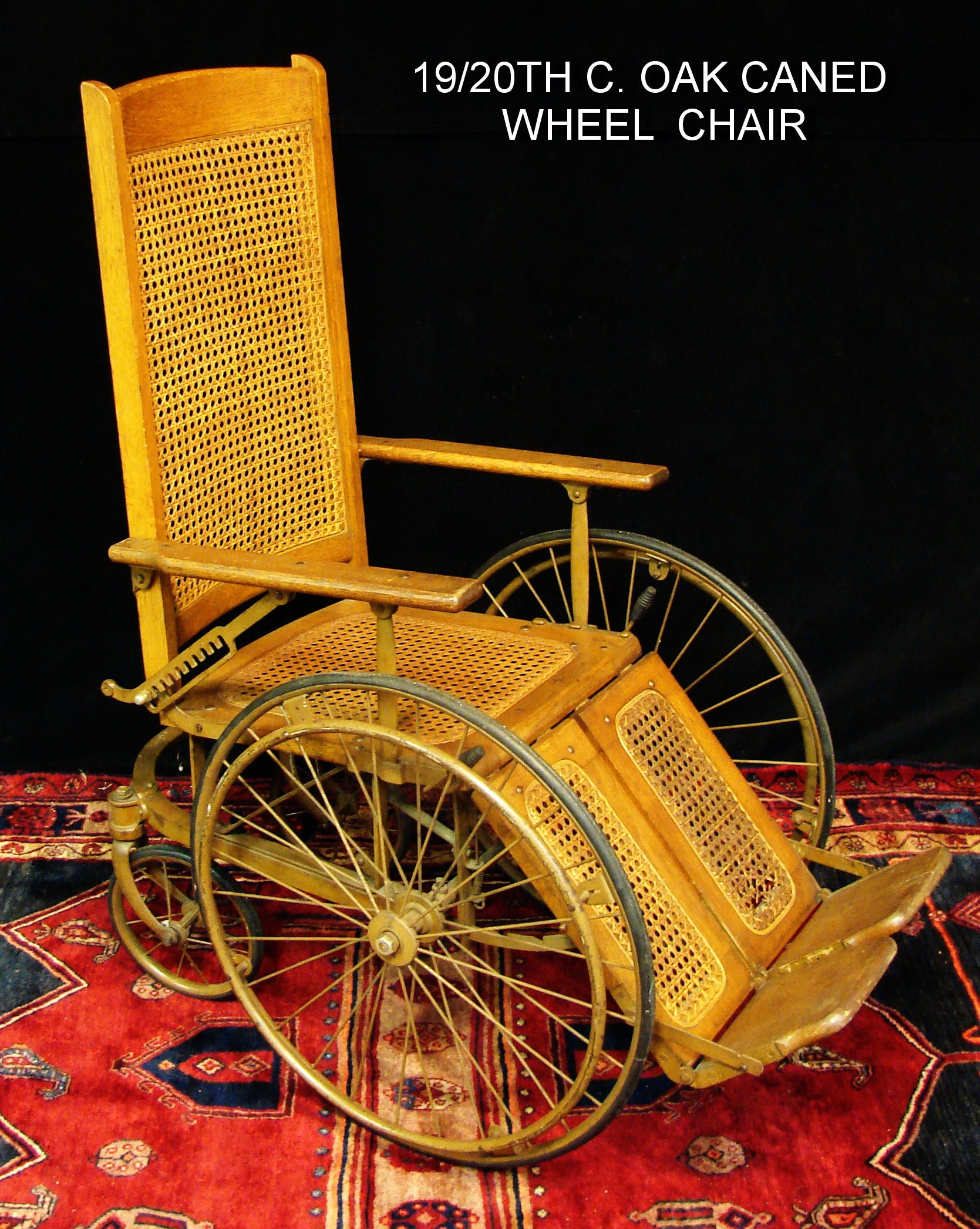 A Late 19th century Oak Wood & Cane Wheel Chair