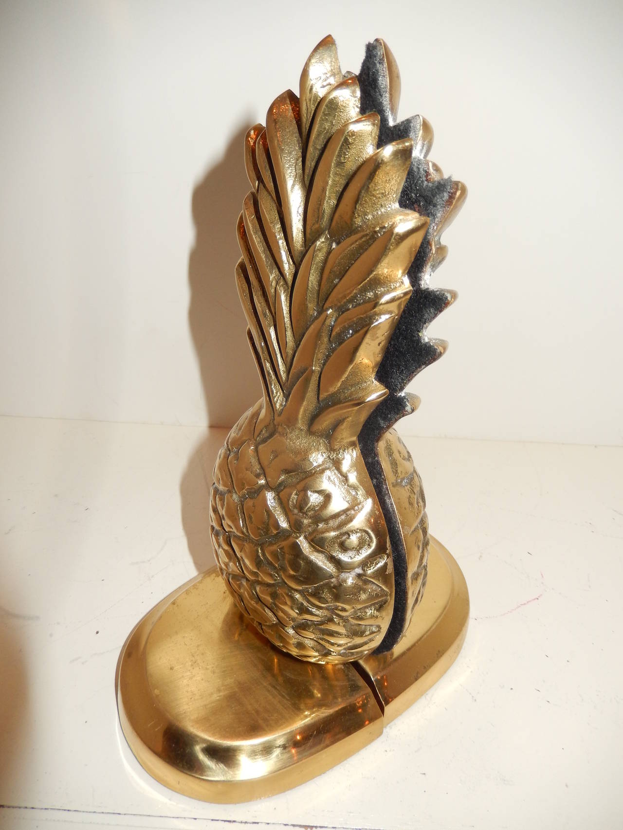 Pair of English Art Deco solid brass pineapple form bookends, showing good detail and weight.
