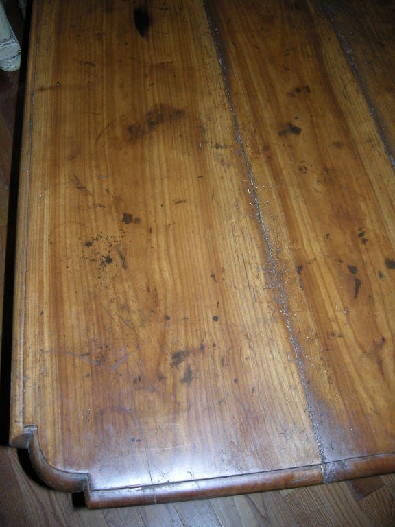 French Provincial 18th century Walnut and Cherry Tavern Table. All hand crafted. Lots of good carved details throughout. The bottom cross stretch is beautifully shaped.Nice beveled table top corners. This piece has many possible uses, center