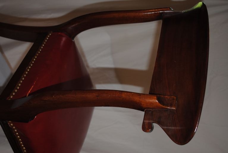 Pair of signed circa 1812-1830 Regency Chairs. Exceptional form with  good detailed Mahogany wood frames,vintage red leather seats, with antique nail heads. One chair is initialed JB the other TT,these initials are pressed into the frames.