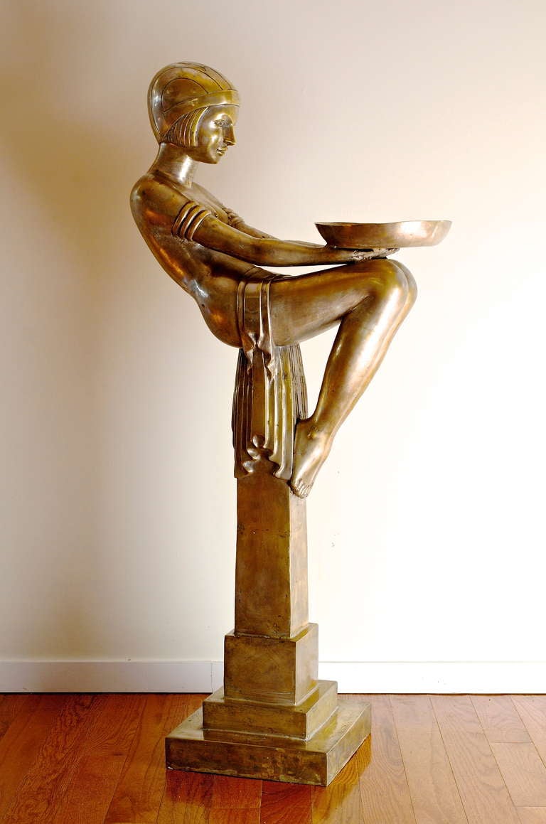 This very rare and beautiful Art Deco female figure sculpture formally from the NY Waldorf Astoria, epitomizes the grandeur and sensuality of the Art Deco era. Crafted of cast brass and silver nickel overlay, she is a wonderful addition to any Art