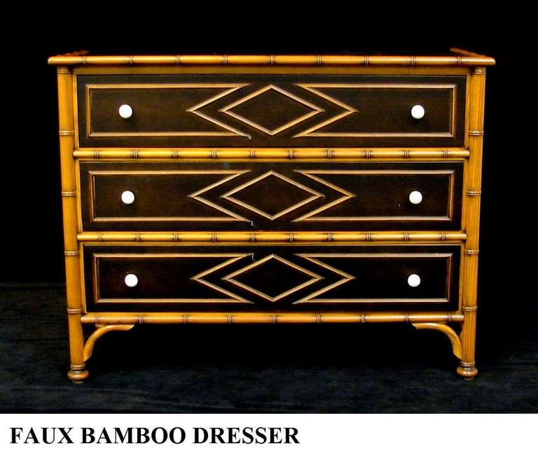 A three drawer Plantation style faux bamboo dresser by Grange of France.
All hand crafted, the encasement is solid cherry wood, the drawers have a chocolate brown stain finish over cherry woods. Faux bamboo trims, decorative relief diamond pattern