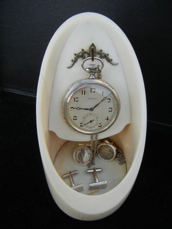 Unique and rare Ivory Tusk 19th century pocket watch stand,carved from one piece.Ideal for cuff links,pocket change,pens,cell phone.A fine gift for the man in your  life. CONTENTS NOT INCLUDED.