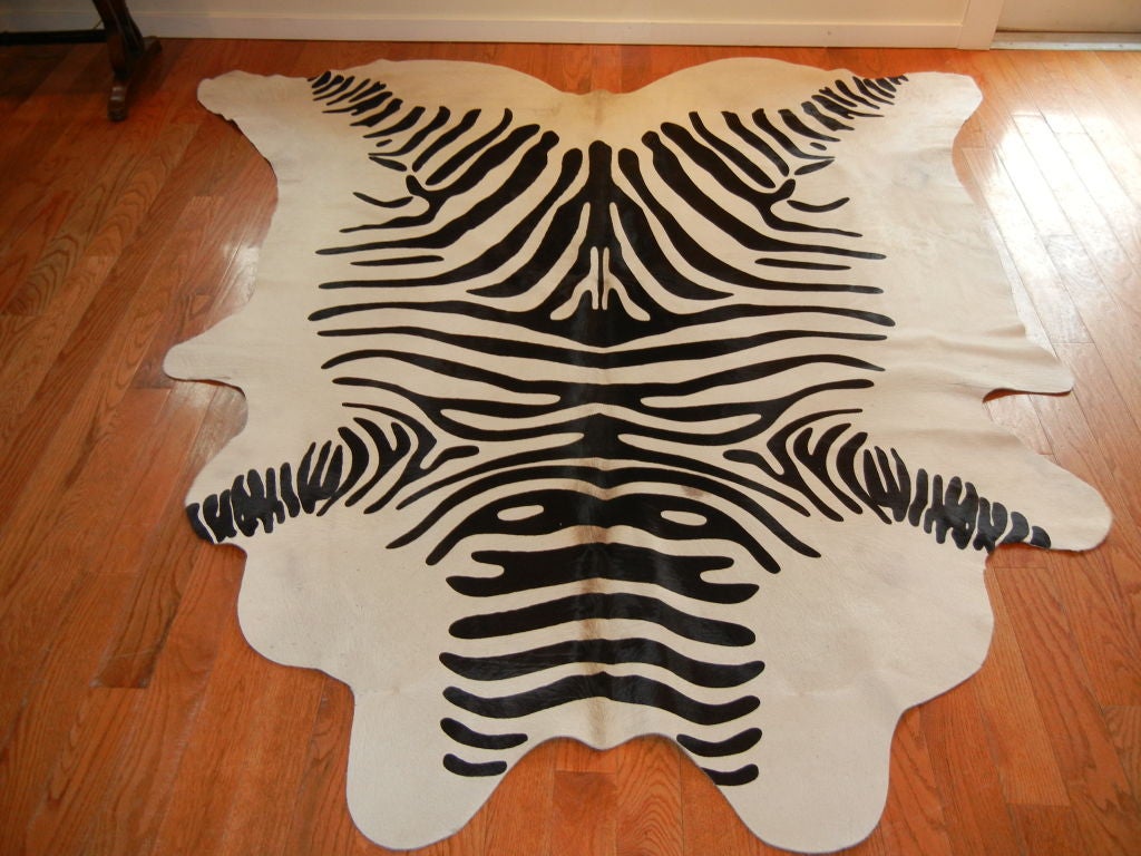 An excellent quality, stenciled zebra print, steer hide area rug.