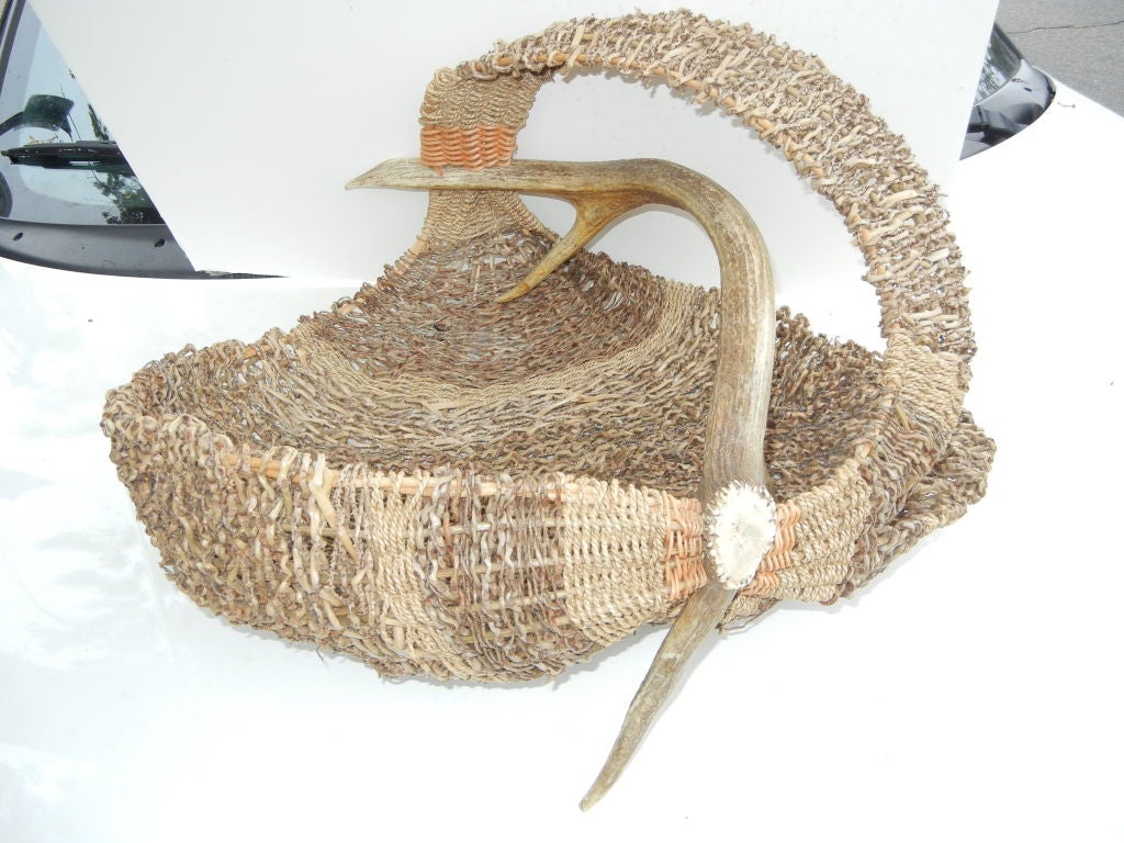A Captivating Master Piece of a Natural Sculptural Hand Made Fiber Basket, with elk horns.<br />
The artist Jan Prince has been inspired to harvest natural fibers and weave them using traditional and experimentally devised techniques,into
