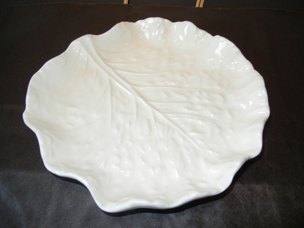 Six lovely  sculptured creamy white majolica cabbage leaf plates.