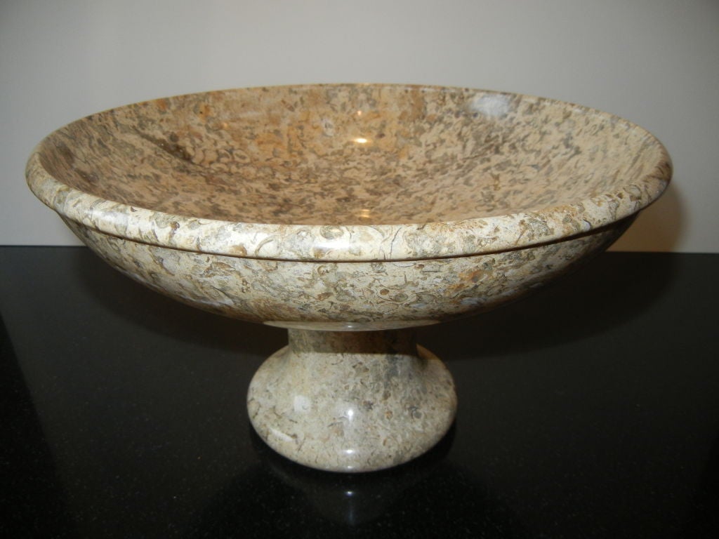 Beautiful fossil stone, shaped into this attractive pedestal bowl. Looking closer into the fossil stone there are shell, stone and bug shapes. Fossil stone is hundreds of years old. Two available.