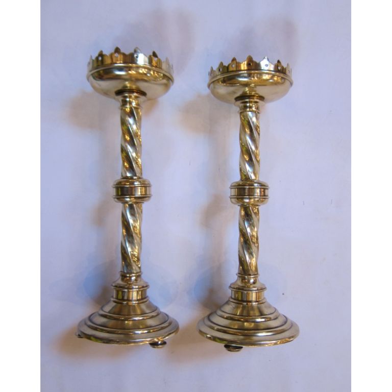 Purchased at Narworth Castle in England. Polished solid brass candlesticks in the Neo-Gothic style. Immaculate condition, heavy in weight, majestic in presence.