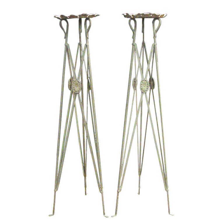 Pair of iron decorative plant stands in the Directoire Style. Perfect for ferns or any hanging plants, fabulous original patina.