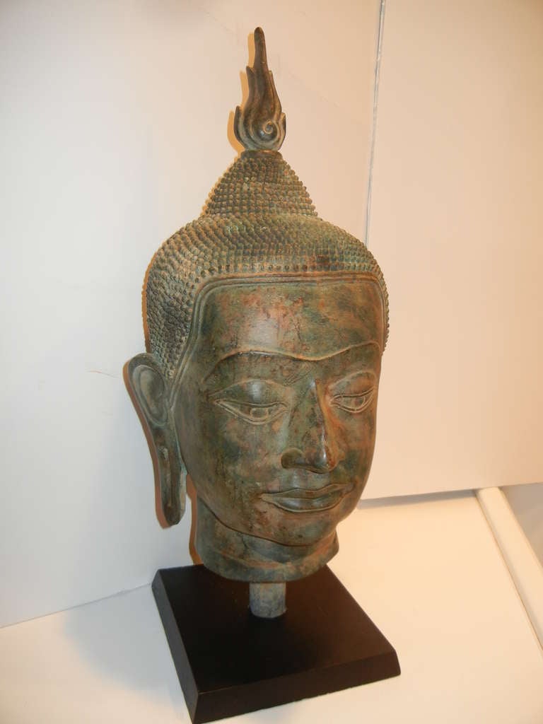 A large 19th century Bronze Buddha Head on stand, please click on to see the actual iron base. Purchased from a Sands Point NY estate. Other Asian collectables also acquired from this group.
The Buddha head measures Height: 21
