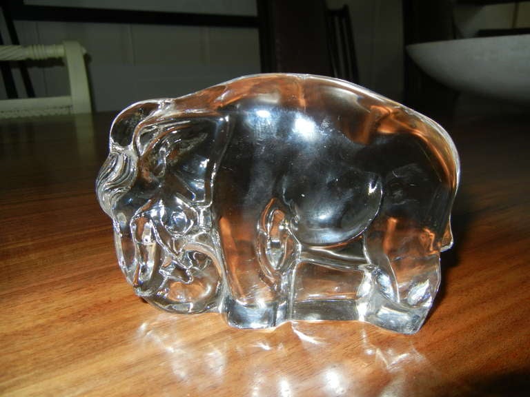 A distinguished gift for a loyal partner, father or friend. The elephant, a symbol of commitment and strength. These heavy and sculptural crystal glass elephants were designed to be used as book ends, but show well as decorative art.