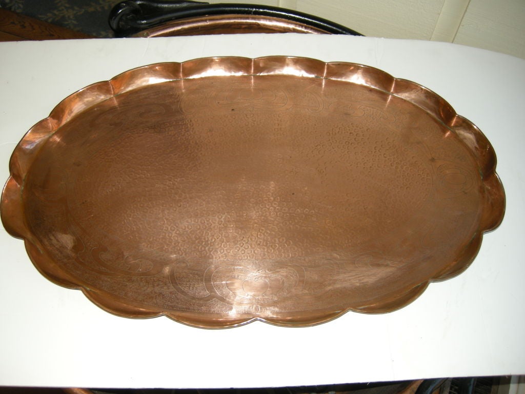 Beautiful Art Nouveau hand hammered copper tray. Art Nouveau relief designs through out the tray, pie crust form, great center piece or can be hung on the wall. Check out the other pieces of copper and brass from the same estate sale in Devon,