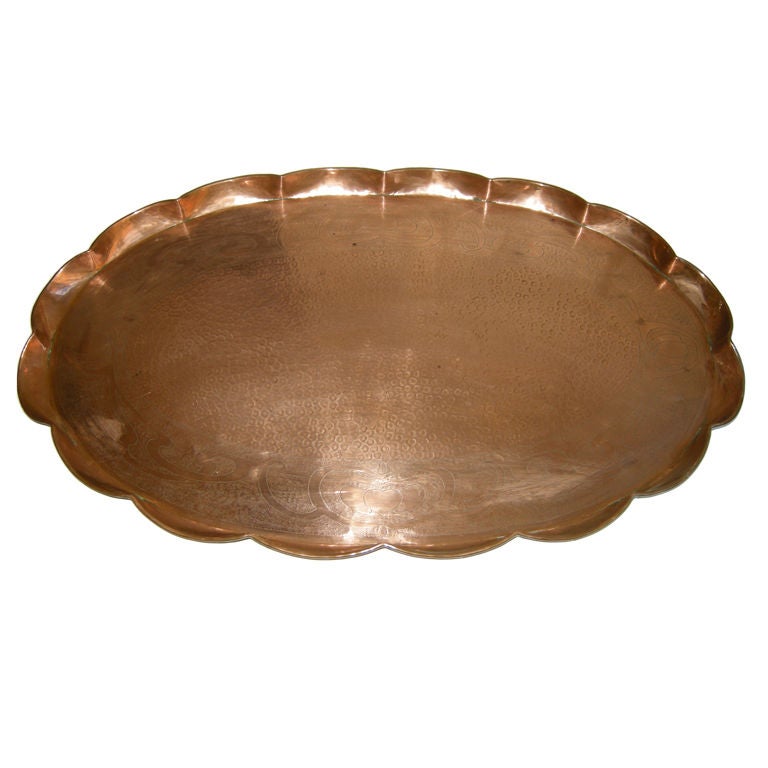 A Large Art Nouveau Hand Hammered Pie Shaped Copper Tray