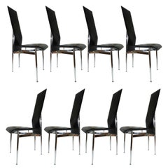 Eight  Leather Dining Room Chairs by Giancarlo Vegni .