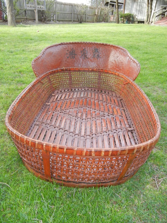 A decorative large bamboo and rattan basket,once used as a portable child's bed. Wonderful for cushions,toys, etc. or just great looking alone or on a wall.