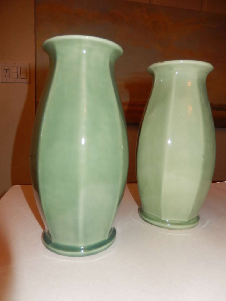Pair of Paul Milet Sèvres Art Deco pottery vases in a beautiful celadon willow-green glaze. They both have octogonal panels on small foot and flared rim. The bottom of the vases are signed 