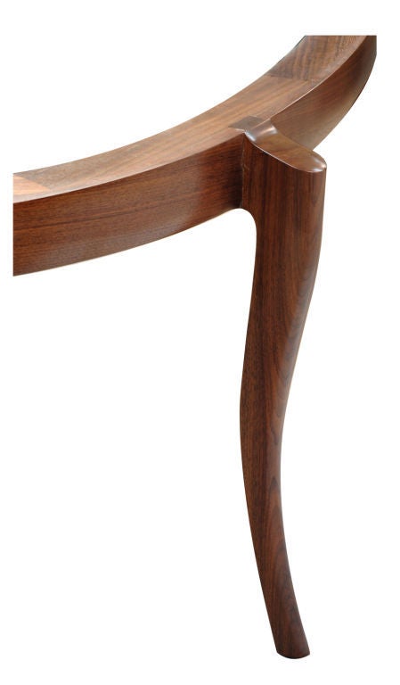 Elegant and beautifully crafted dining room table by American studio Craft artist David N. Ebner. Shown in walnut wood, however other woods are available (price may vary with size and wood choice).

Note: All works signed by the artist, David N.