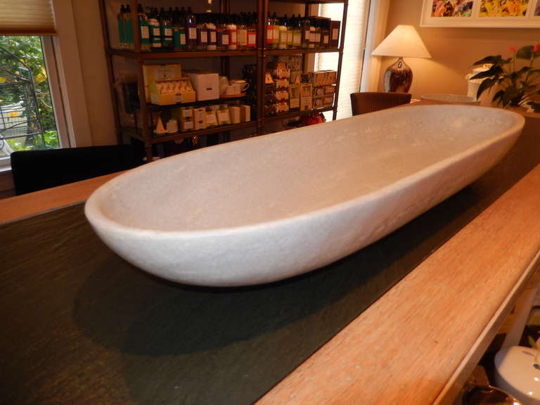 A massive large white marble ovate bowl, measuring 30 inches long, 5 inches high and 4 inches deep. Hand lathed of white Italian marble.