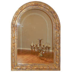 An Oversized French Arched Giltwood Carved Floor Mirror