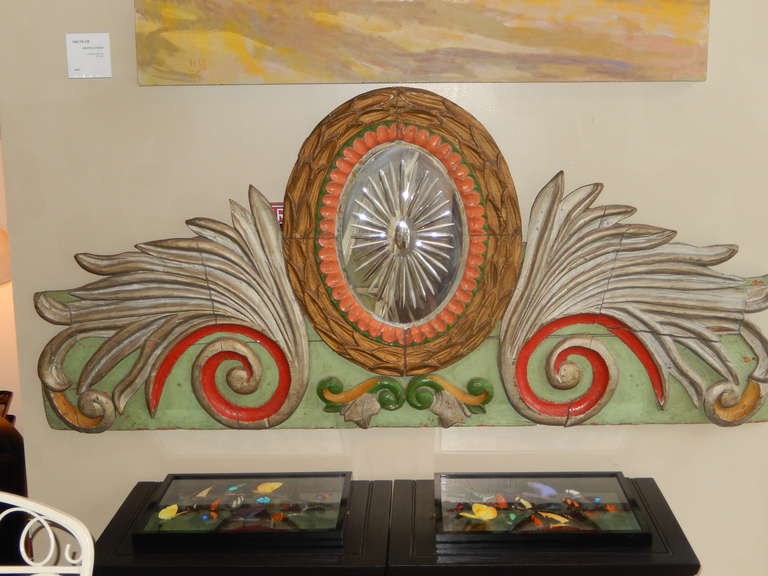 A wonderful Americana Carnival Art wall decoration. Original paint in red, green, silver, brown and orange. Hand carved relief.