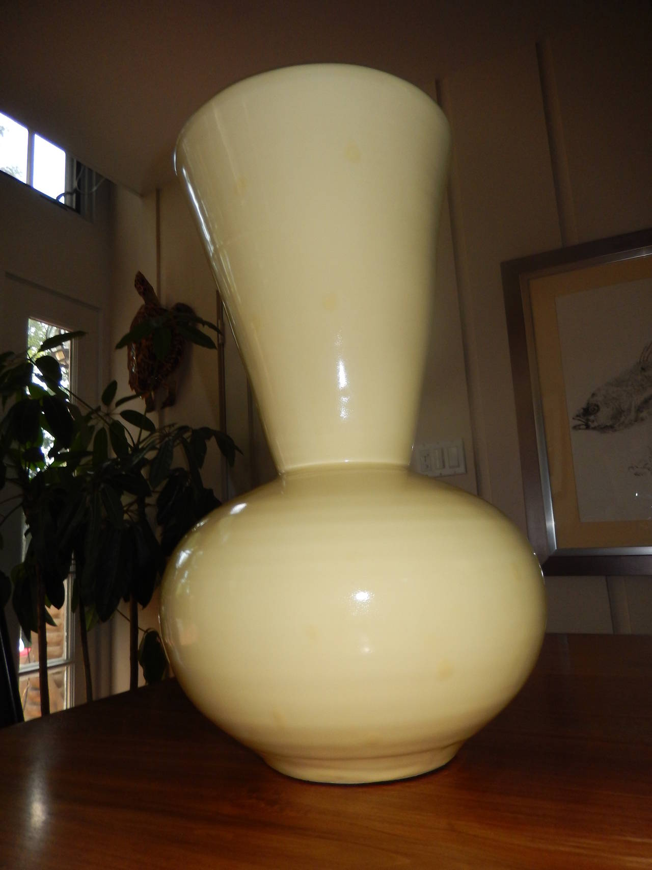 A rare find in this  extraordinarily beautiful Christopher Spitzmiller custom vase,there were only 10 ever crafted by Christopher. The bisque is almost a 1/2 inch thick; the color is a warm yellow, with a jewel tone glaze.Please note there is now