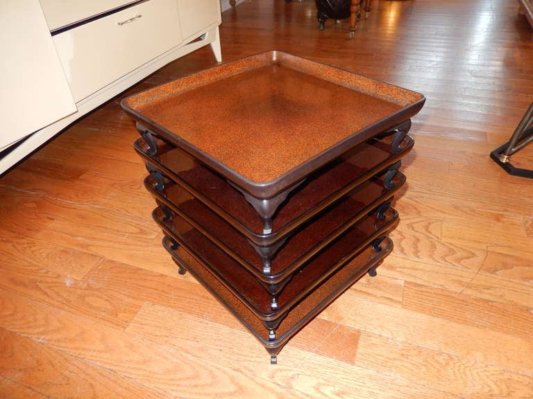A rare find in these 5 1920s Japanese  serving trays. The tray tops have a rich speckled golden brown finish,rosewood frames (lacquered) a beautiful group.We have the original five shelf custom wood built storage case for the trays.