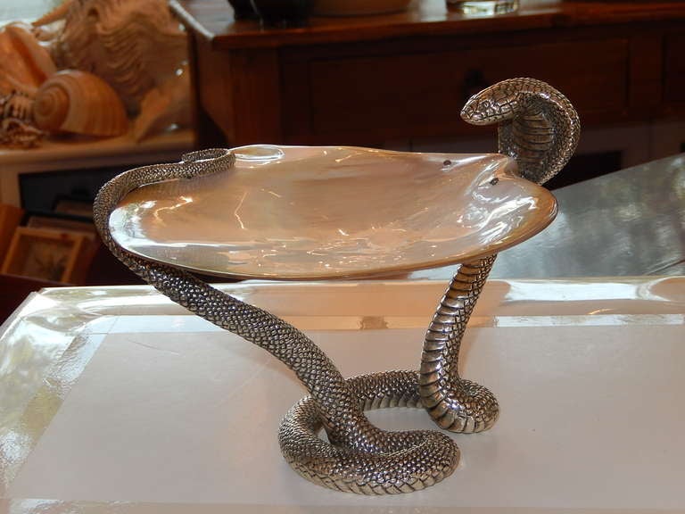 Exceptional Studio Crafted platter in the Art Deco style. The cobra is wrapped around a highly polished abalone shell .The cobra is made of brass with a sterling silver coating, the vessel is food safe, perfect for caviar. Or just to admire, as the