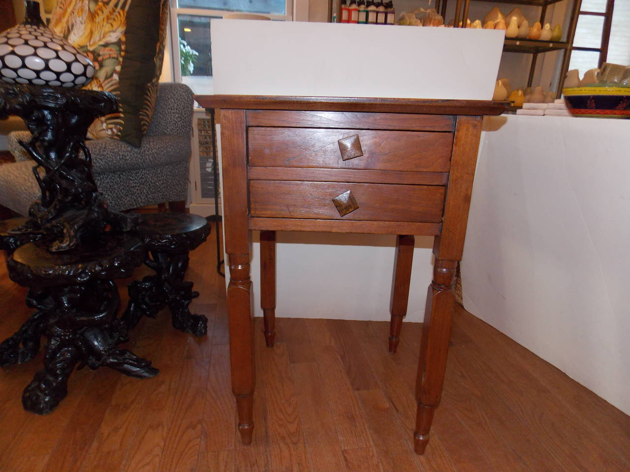 A late 19th century two-drawer American nightstand with two pull-out drawers. The original square pulls still in place. A lovely American provincial piece.