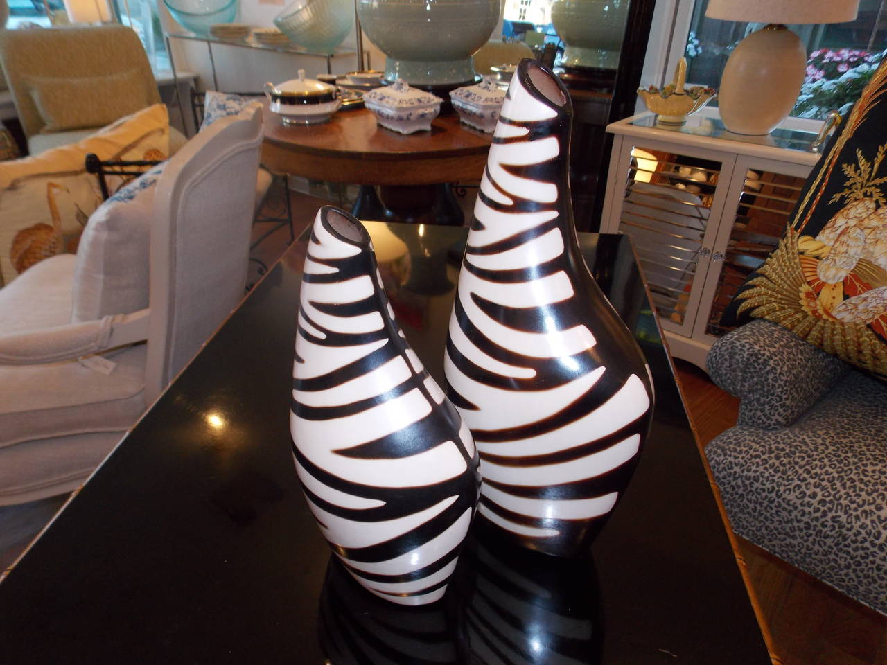 Paired together these black and white sculptural vases/vessels make an outstanding contemporary statement. Had thrown and hand-painted. 
The larger one measures H 15 inches, D 8 inches, the smaller one measures 
H 11.5 inches D 7 inches.