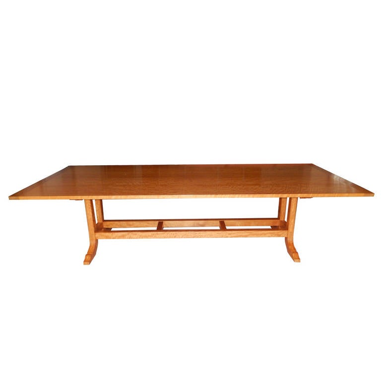 A magnificent one of a kind dining room table or conference room table by studio Craft artist David N. Ebner. This table is cut from one continuous length of solid Makore wood from Sierra Leone, Africa.
The table seats 12 to 14 people very