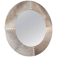 A Large Round Stone Grey Cow Hide Mirror