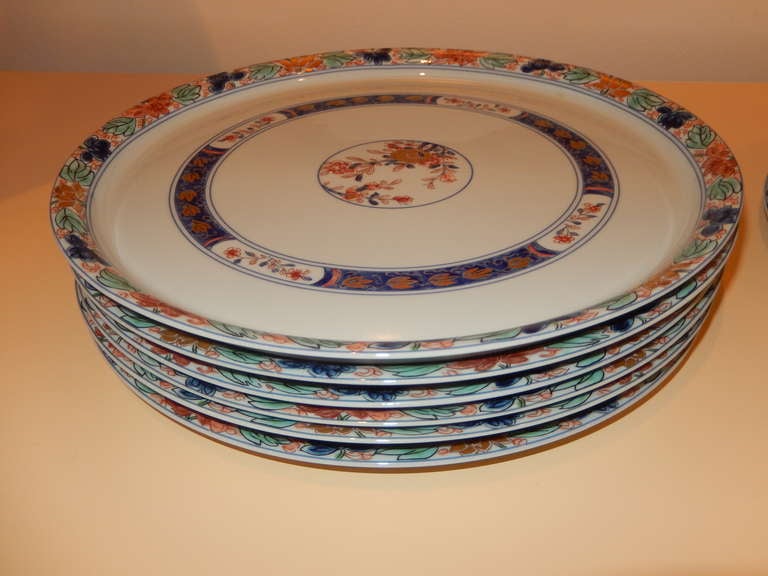 Twelve exceptional Imari/Limoges Charger plates. Egg shell blue with hand painted imari colors and patterns, all 12 in unused condition. Marks on back shown in additional images, as follows.
France, Unic, Limoges.