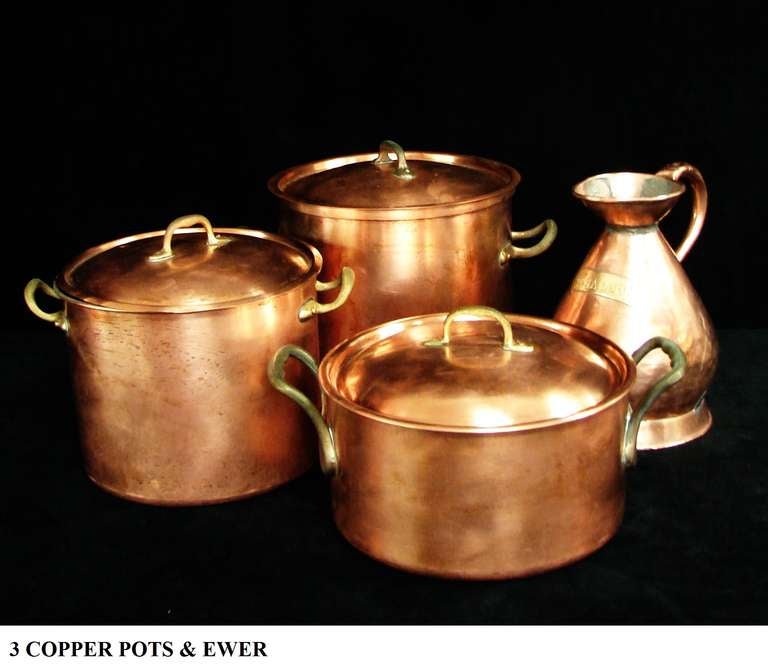 A nice group of three Antique English copper pots with lids, and one ewer with a brass plaque etched (1/2 Gallon).