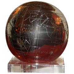 A Mid-Century Chrome & Lucite Rotating Globe