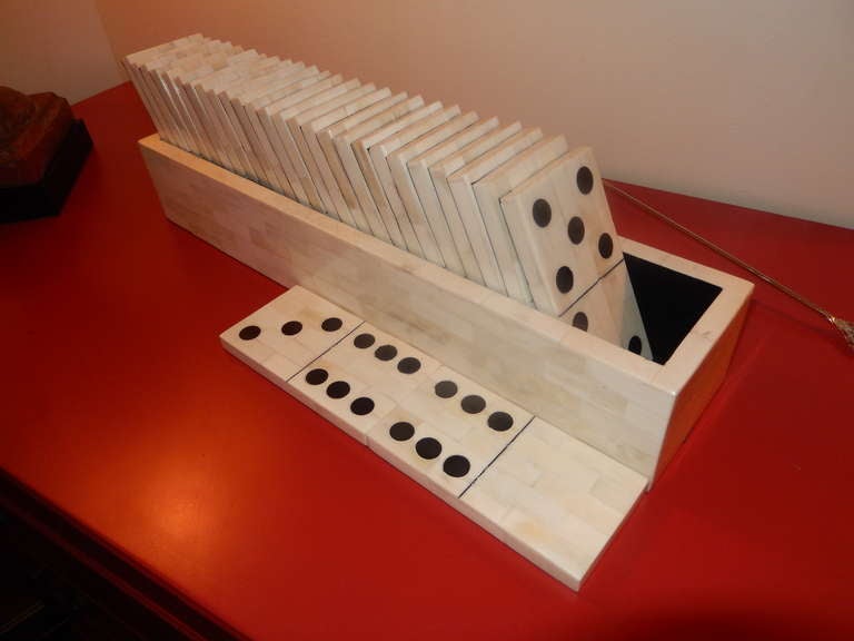 A very large scale boxed domino set from North Africa; made of wood with bone veneers. The box is lined in velvet, with a black felt bottom, quite the conversation piece, and a great gift, to be shared.