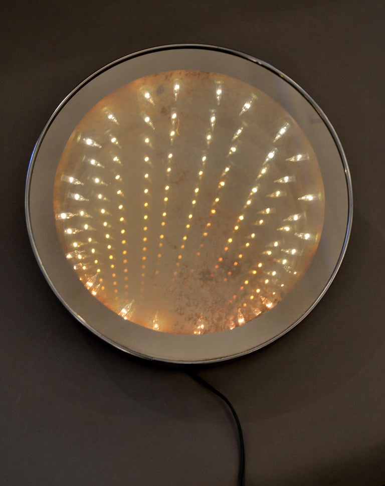 An amazing optical illusion wall mirror, when lit the mirror turns into    an infinite portal of lights.