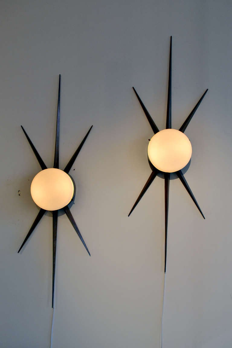 A rare set of sconces by Gio Ponti (1891-1979) for Arredoluce, Italy. The sconces are from the early 1950s and are in wonderful condition.