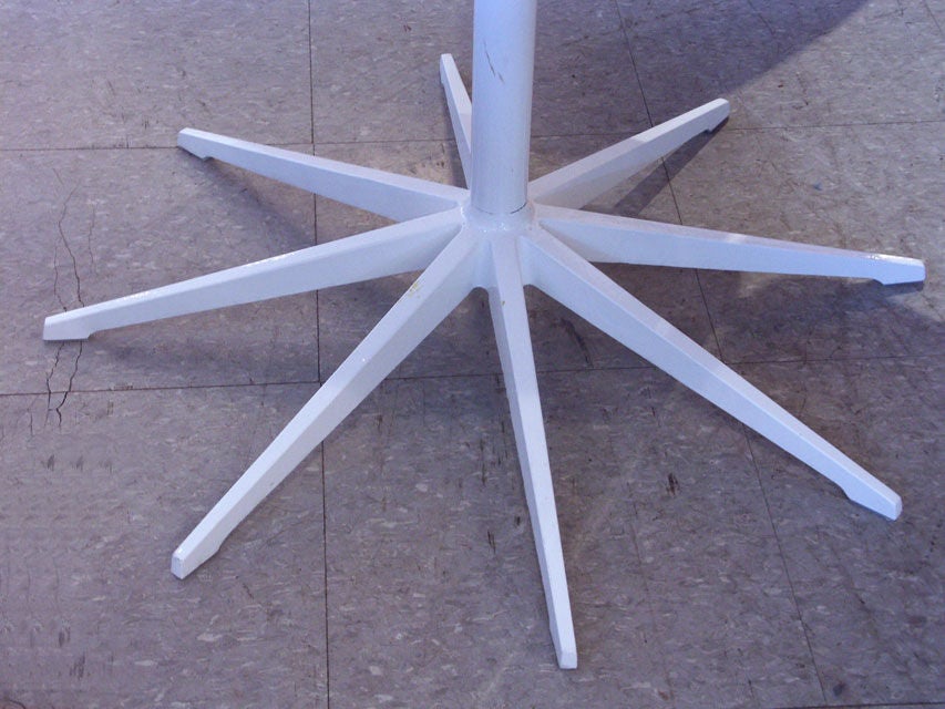 Beautiful pair of Schultz's iconic petal table design, manufactured by Knoll. An array of 8 solid teak wedges form the flower form table top. Raised on a gloss white stem, and 8 point star base. Price is per table.
