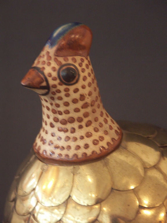 Adorable pair of decorative chickens, rendered in glazed ceramic and brass by Blazquez, Mexico. Artfully imagined ceramic heads are set onto bodies of layered brass feathers. The larger chicken bears a label A> BLAZQUEZ made in mexico.