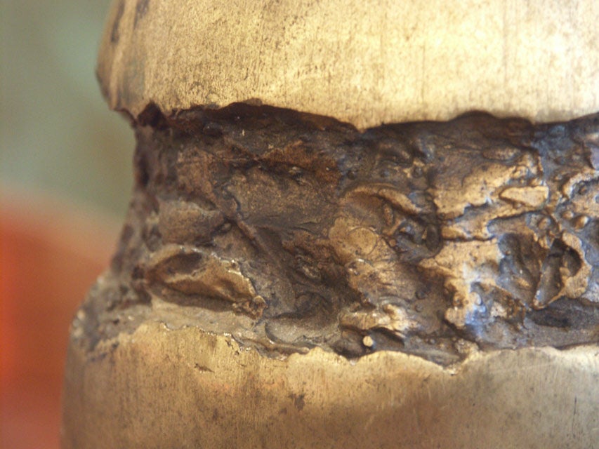 An Abstract Bronze Egg Sculpture